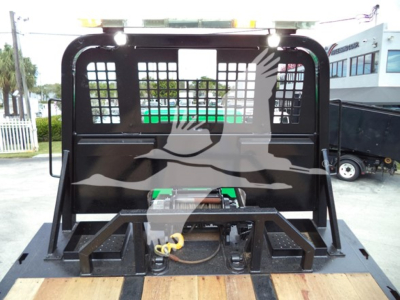 Peterbilt 348 rollback truck bed rear view showing hydraulic winch and mounts.