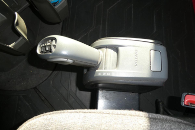 Volvo gear shift lever in cab showing gear selector with VOLVO branding and '2605' markings.
