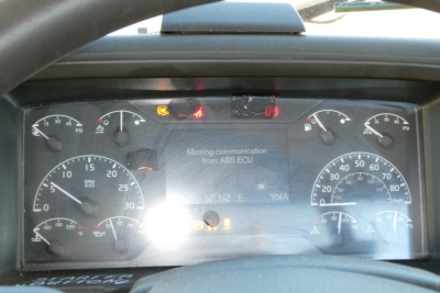 Volvo VNR64T300 dashboard showing instrument cluster and warning lights, ABS ECU communication alert on display.