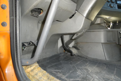 Interior of a Volvo VNR64T300 truck cab showing floor mat and pedals with steering column area.