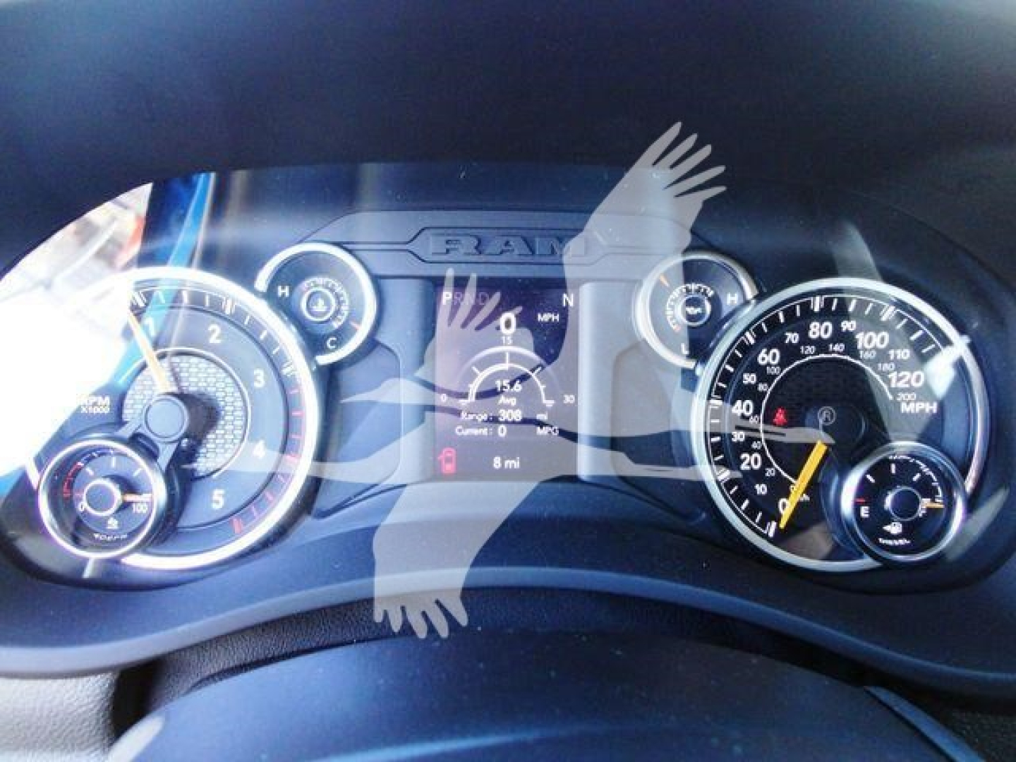 Dashboard view of a RAM 5500 truck showing gauges and central instrument display with speedometer and tachometer.