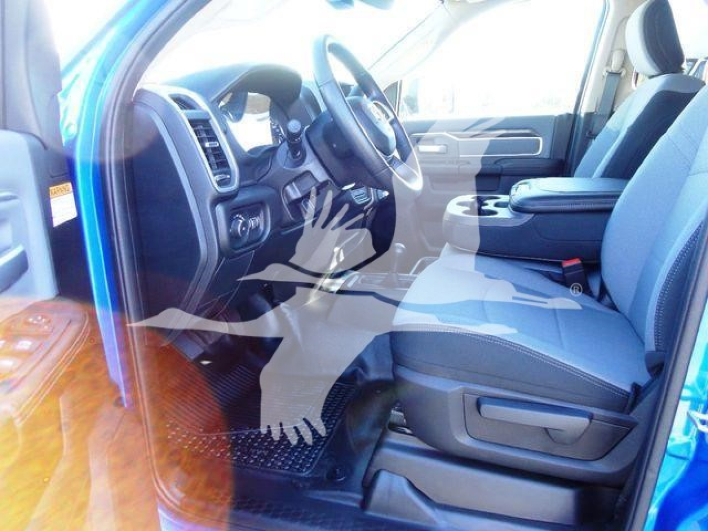 Ram 5500 interior view showing front driver and passenger seats, steering wheel, center console, and dashboard.