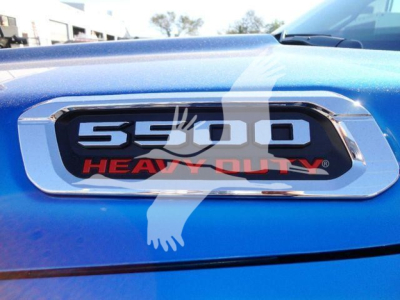 Ram 5500 Heavy Duty badge on blue vehicle hood.