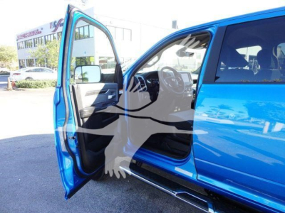 Ram 5500 SLT pickup truck with front-left door open showing interior dashboard and steering wheel.