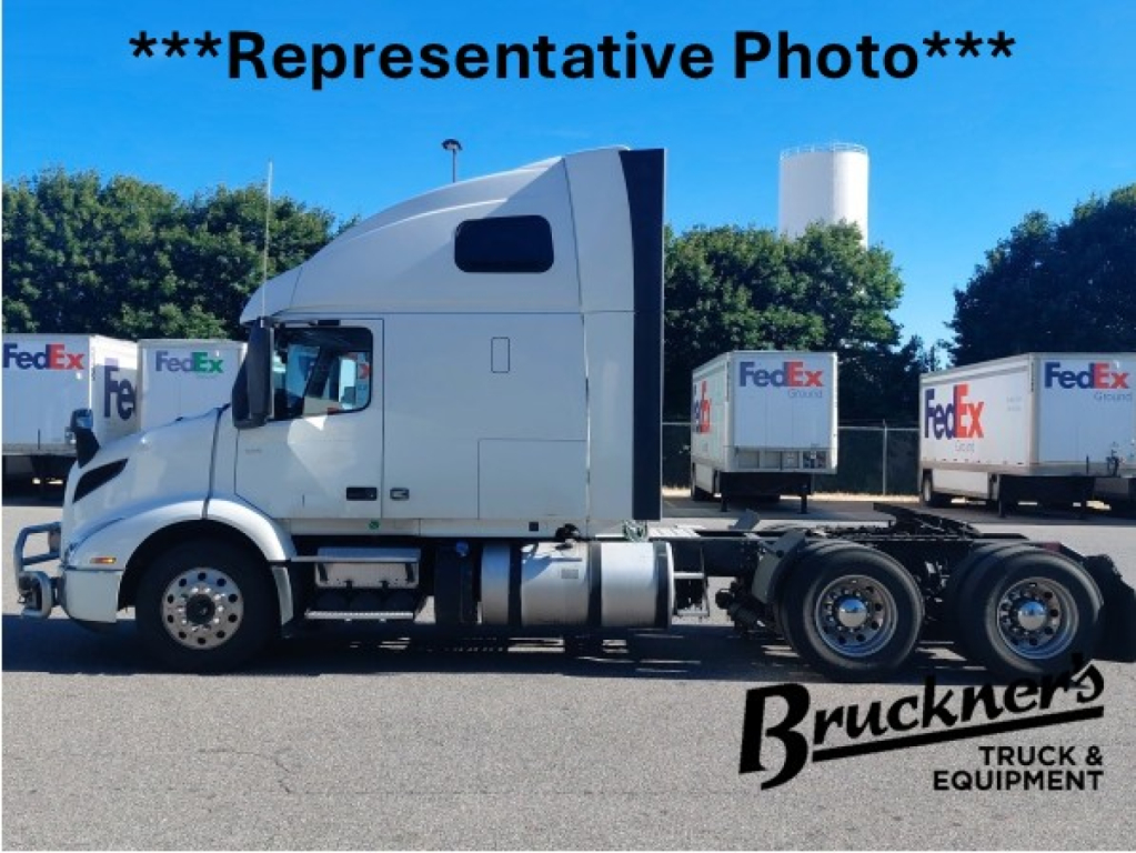 Volvo VNR64T660 sleeper cab tractor-trailer side view with FedEx trailers in background, Bruckners Truck & Equipment logo overlay.