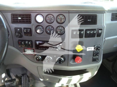 Peterbilt 567 interior dashboard showing multiple gauges and controls.