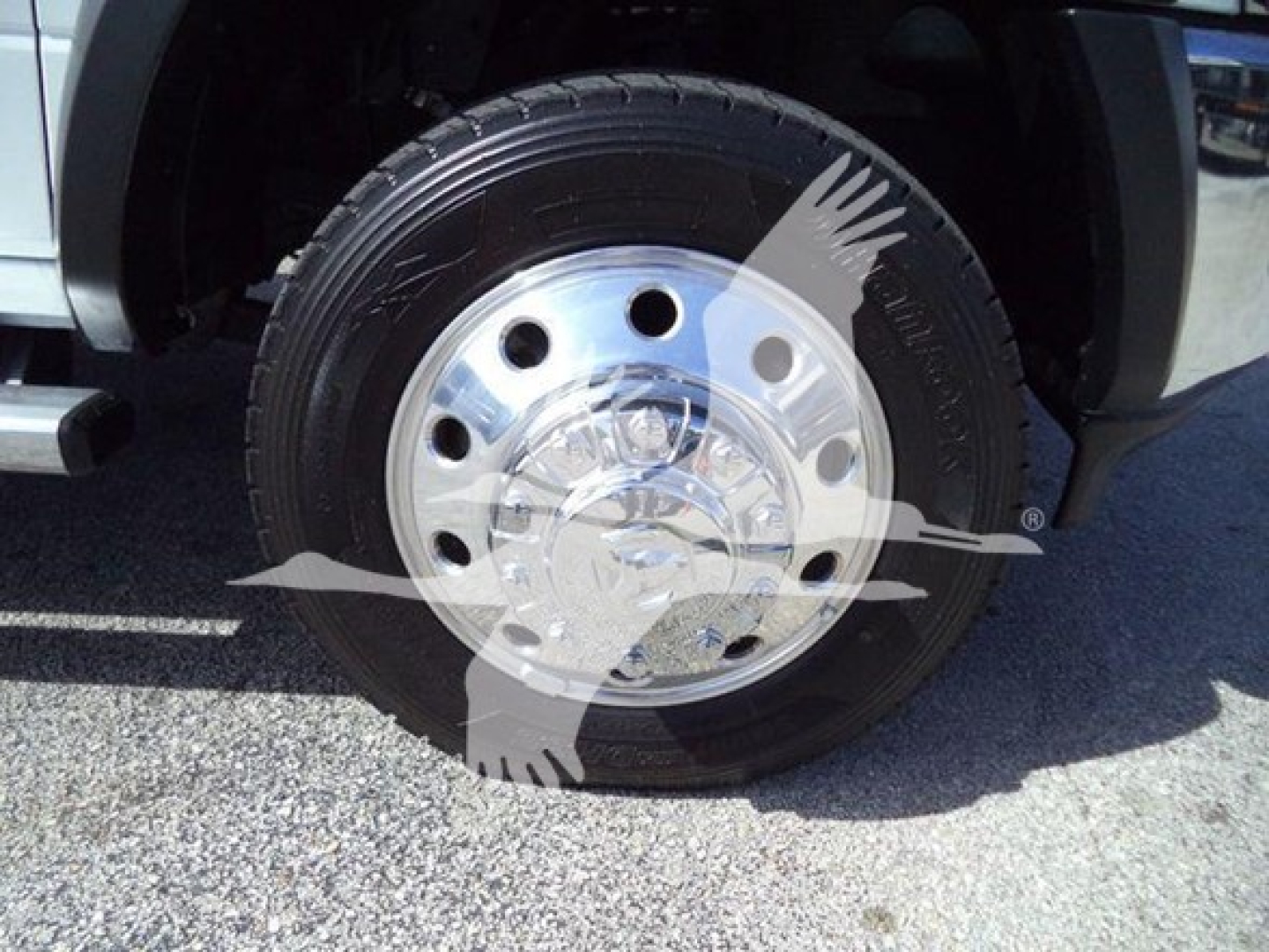 Front wheel of a 2024 Ram 4500 SLT showing a chrome wheel and tire with a partial wheel well; text on image includes Winch category and stock number overlay.