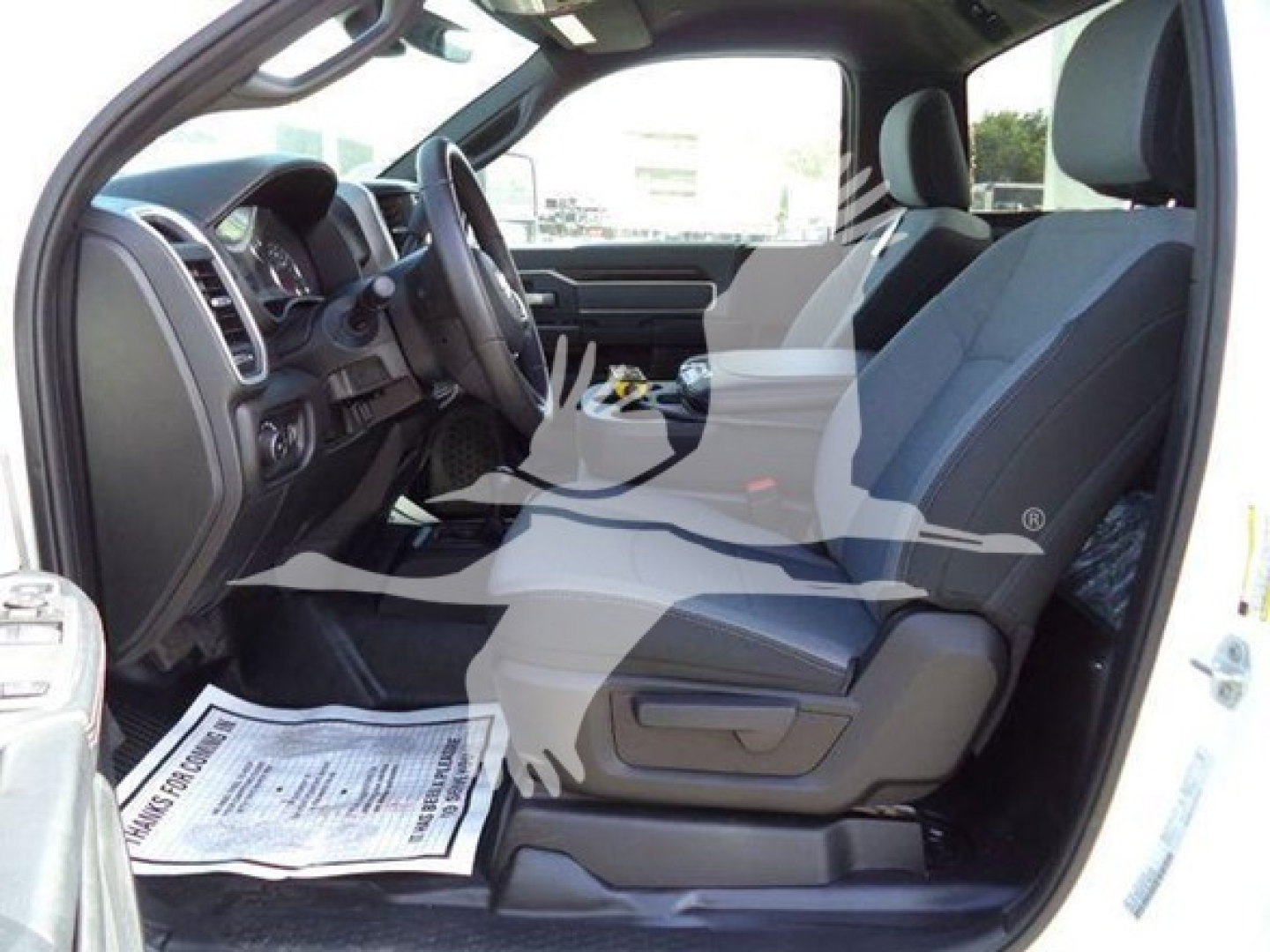 Ram 4500 SLT interior passenger and driver seats, dashboard, and steering wheel visible in a pickup truck cabin.
