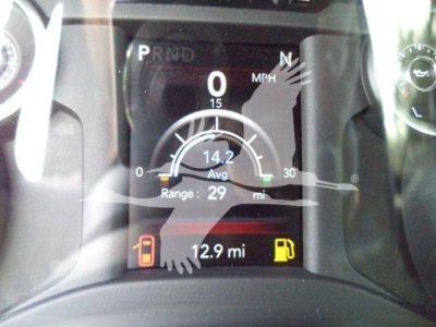 Dashboard display of a Ram 4500 truck showing 0 MPH, 14.2 avg, 29 mi range, 12.9 mi trip, fuel gauge icons, and PRND gear indicator.