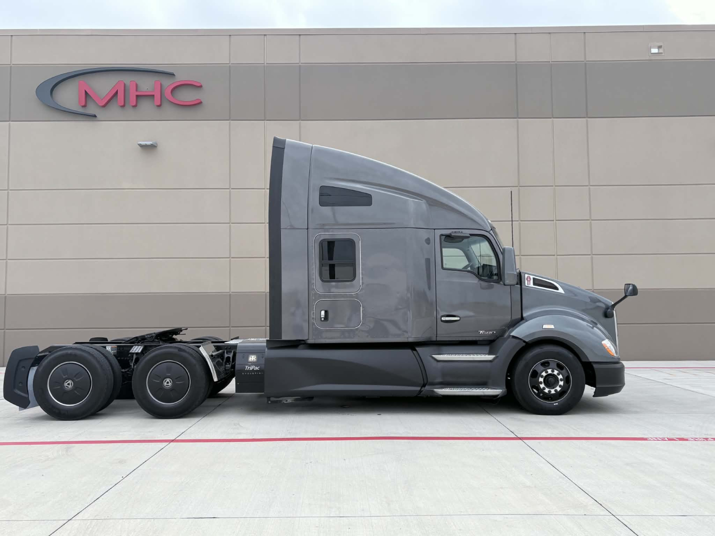 Kenworth T680 tractor in profile view showing sleeper cab and rear wheels.