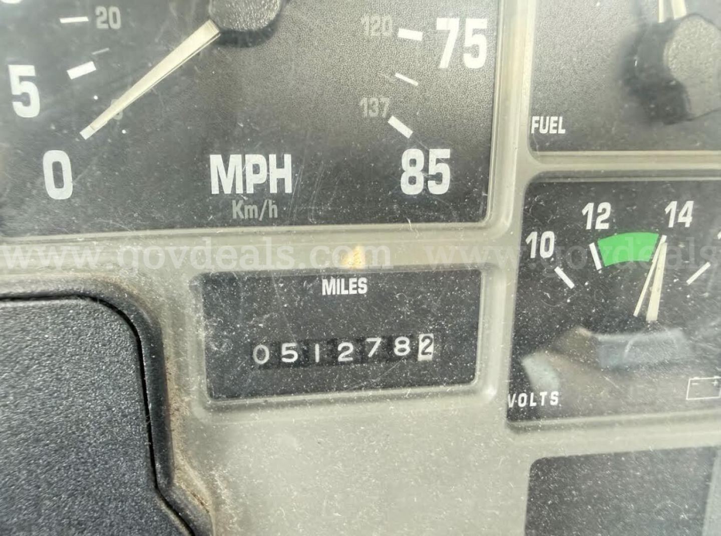 Dashboard of a 1996 International 4700 showing speedometer with MPH, odometer reading 0512782 miles, and fuel/volt gauge.
