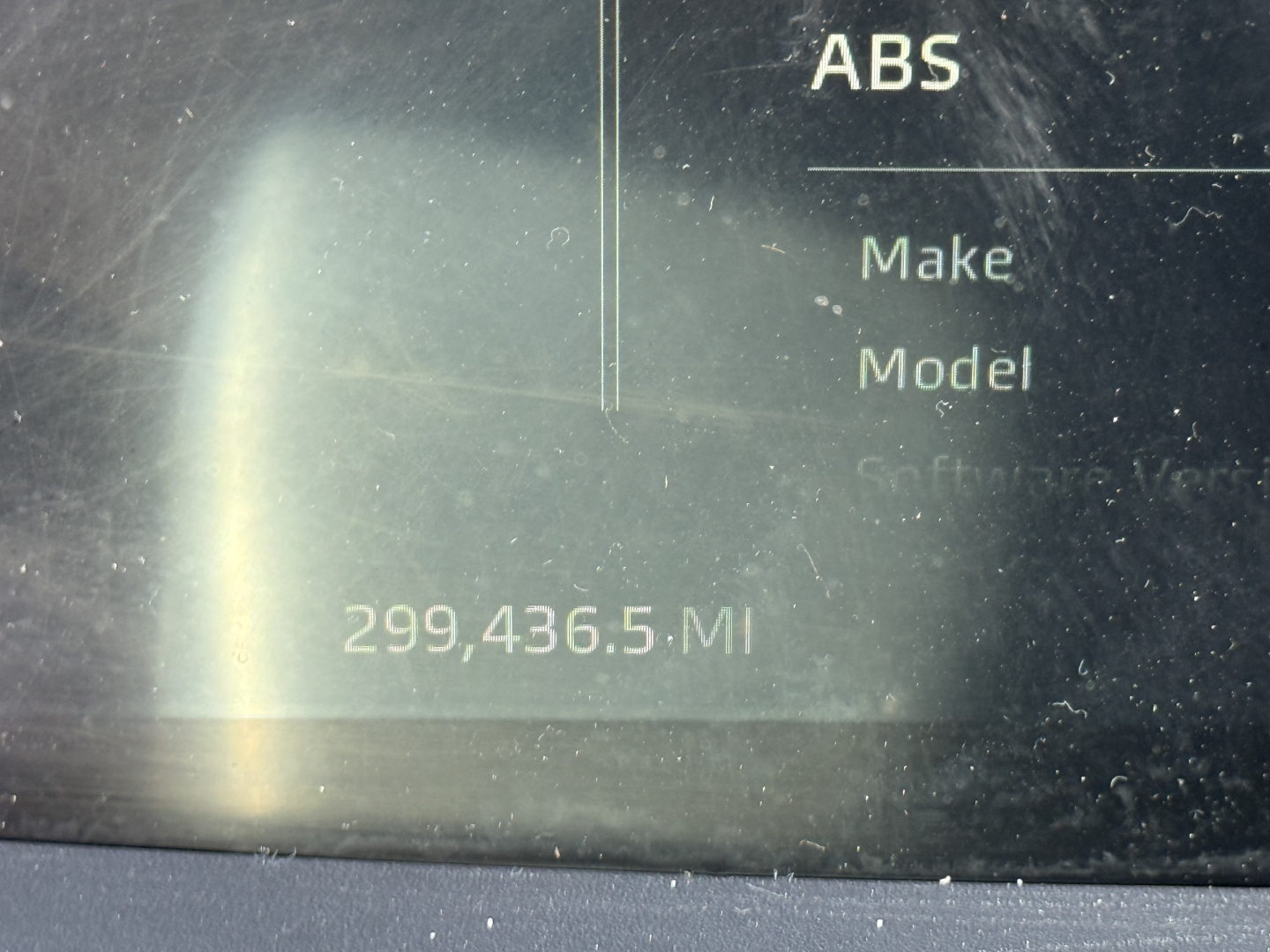 Kenworth T680 dashboard display showing ABS indicator and odometer reading 299,436.5 miles.