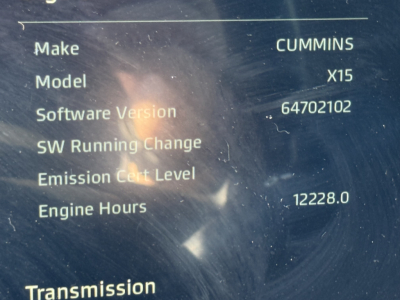 Kenworth dashboard readout showing Make: Cummins, Model: X15, Software Version: 64702102, SW Running Change blank, Emission Cert Level blank, Engine Hours 12228.0.