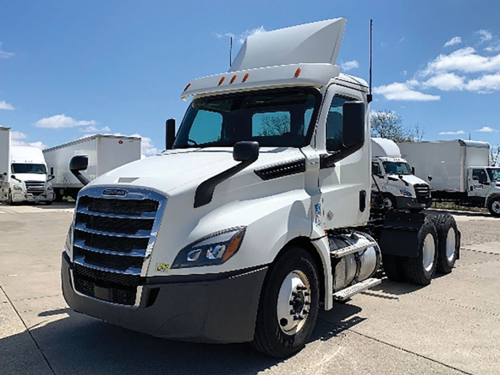 2019 Freightliner Cascadia126 tractor unit in a truck yard showing the cab and raised sleeper area.