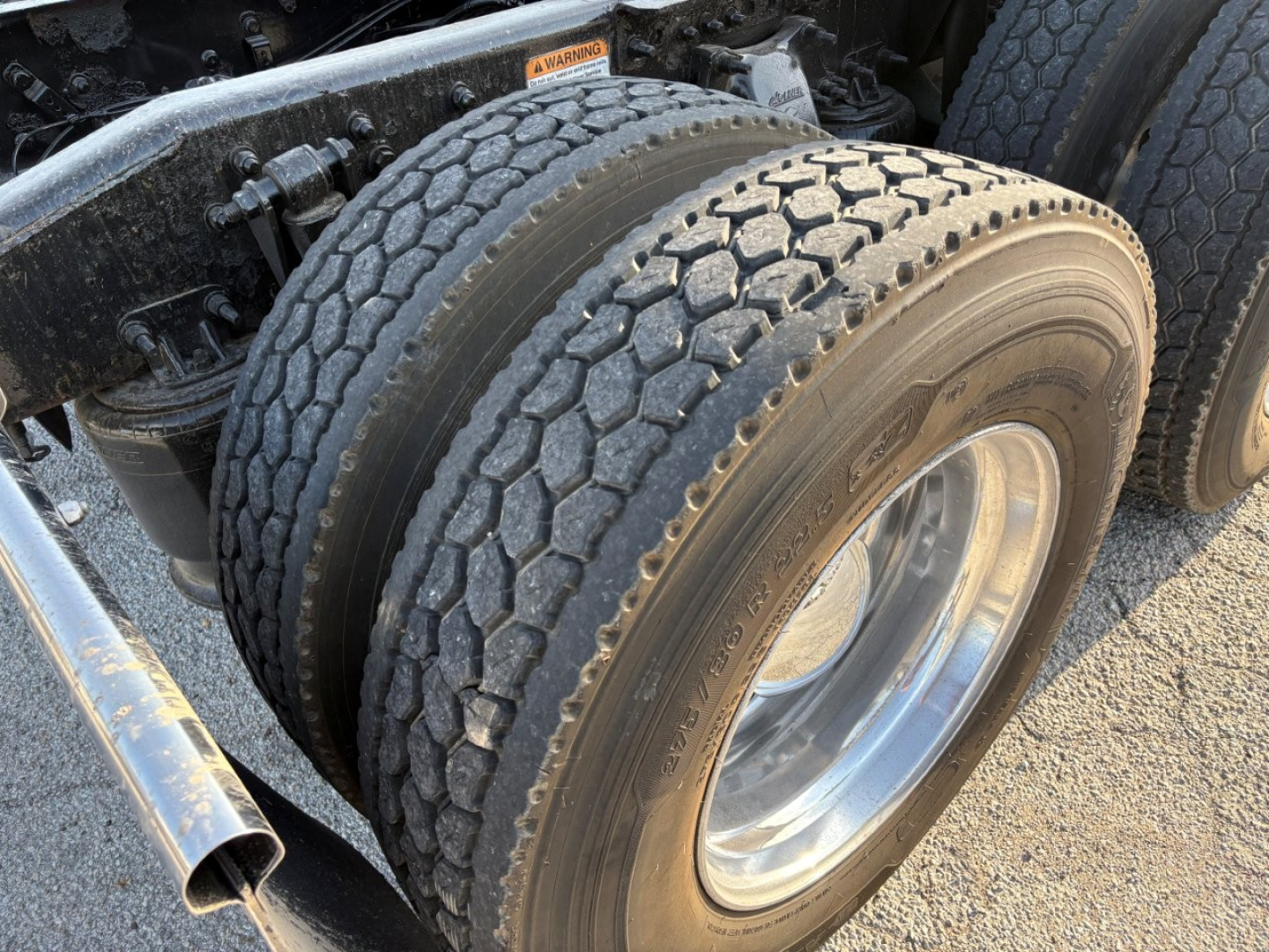 Freightliner Cascadia 126 truck dual rear tires showing tread and wheel with visible sidewall details.