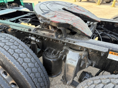 Freightliner Cascadia 126 truck chassis showing fifth wheel and suspension components with labels and hoses.