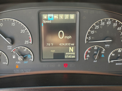 Front dashboard of a 2023 Freightliner Cascadia 126 showing digital display with speed 0 mph, ambient temp 70°F, trip 424.832 miles, gear N, and controls icons.