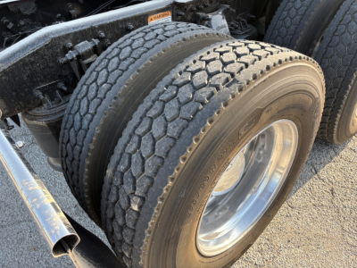 Freightliner Cascadia 126 truck dual rear tires showing tread and wheel with visible sidewall details.
