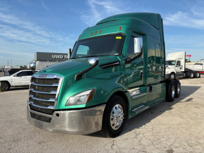 Freightliner Cascadia 126 tractor-trailer in green, front-left view showing chrome bumper, grille, and sleeper cab.