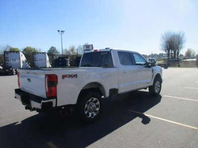 Ford F-350 pickup truck with FX4 badge in a dealership lot, rear three-quarter view