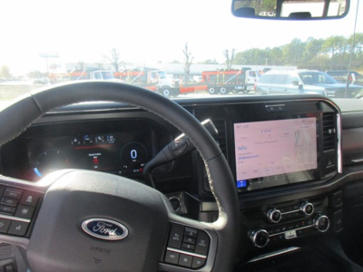 Ford F-350 interior dashboard showing steering wheel and touchscreen infotainment system.