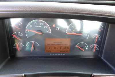 Dashboard of a Volvo VNM64T truck showing multiple gauges and a central digital display with service DIF? and indicates N R E gear indicators and speed limits.