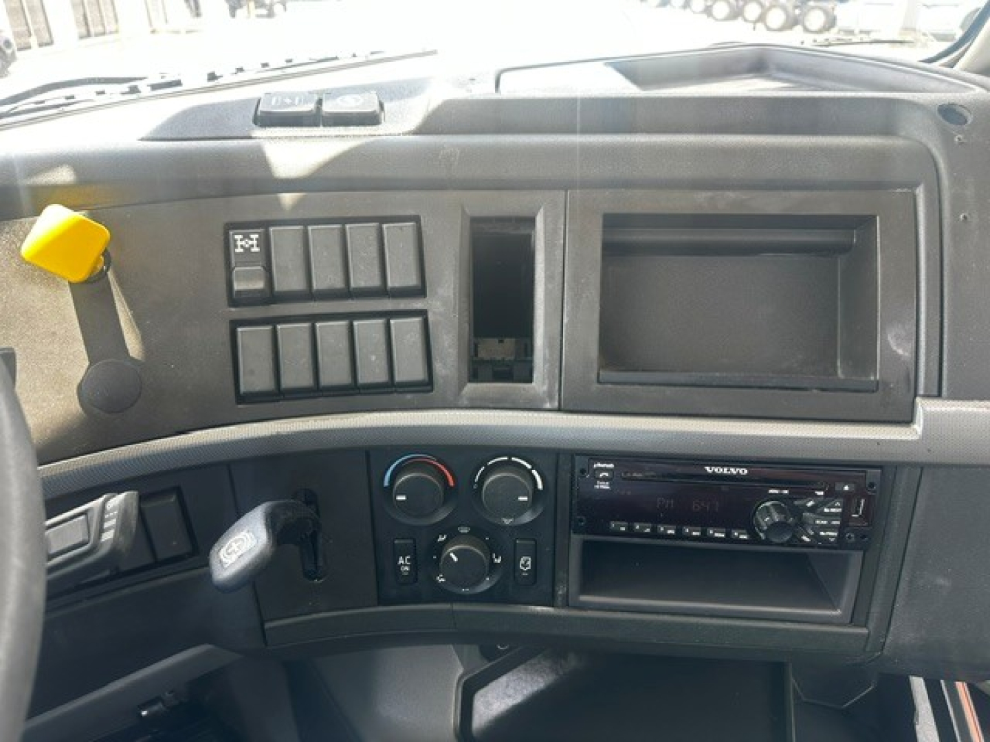 Volvo VHD dashboard interior showing various switches and a blank dash slot.
