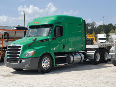 Green Freightliner Cascadia126 tractor truck side view with sleeper cab and chassis, STL cab, front grille, and dual rear wheels.