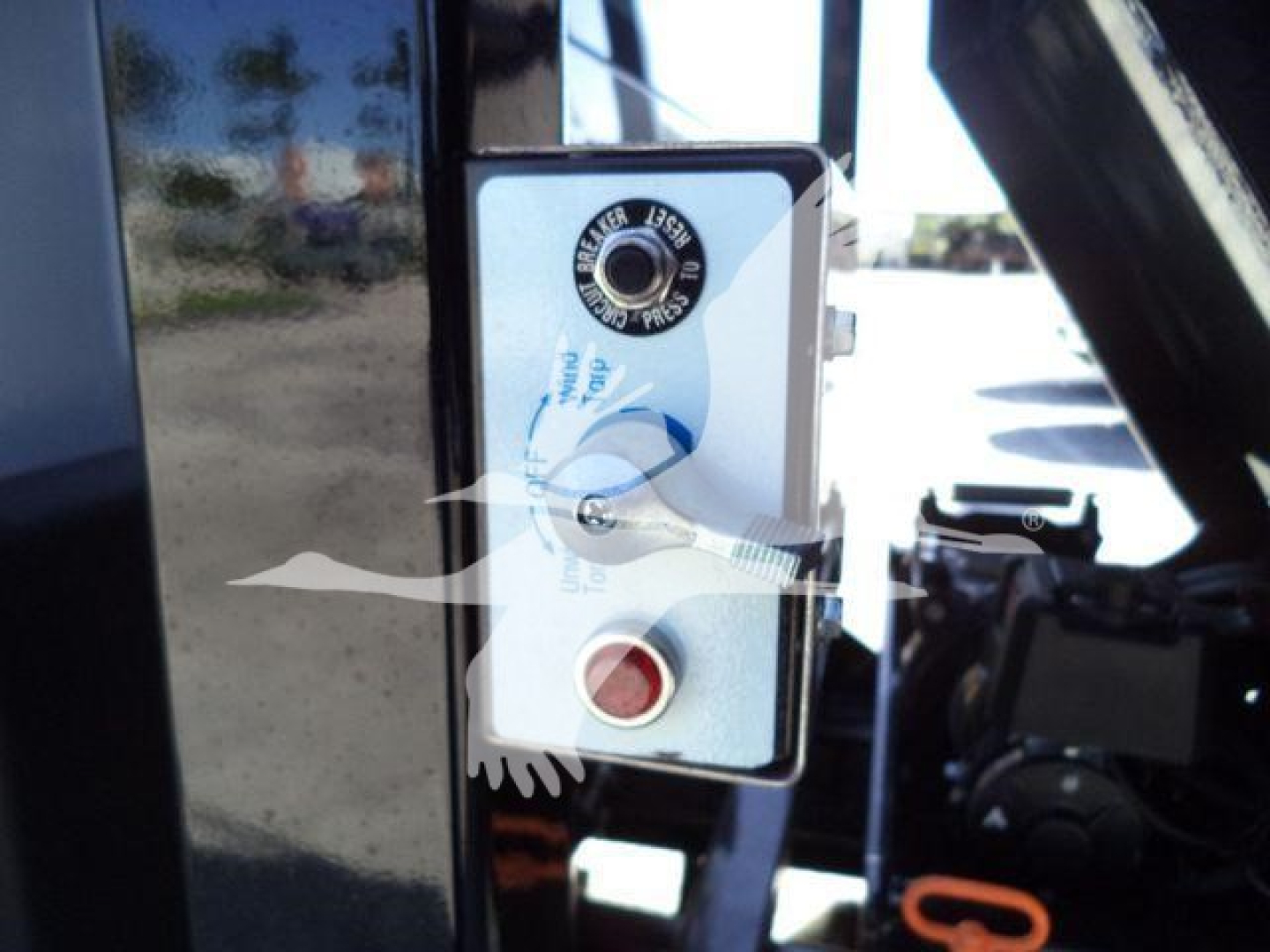 Chevrolet Silverado 6500HD rollover truck door area with circular key tumbler and control panel visible