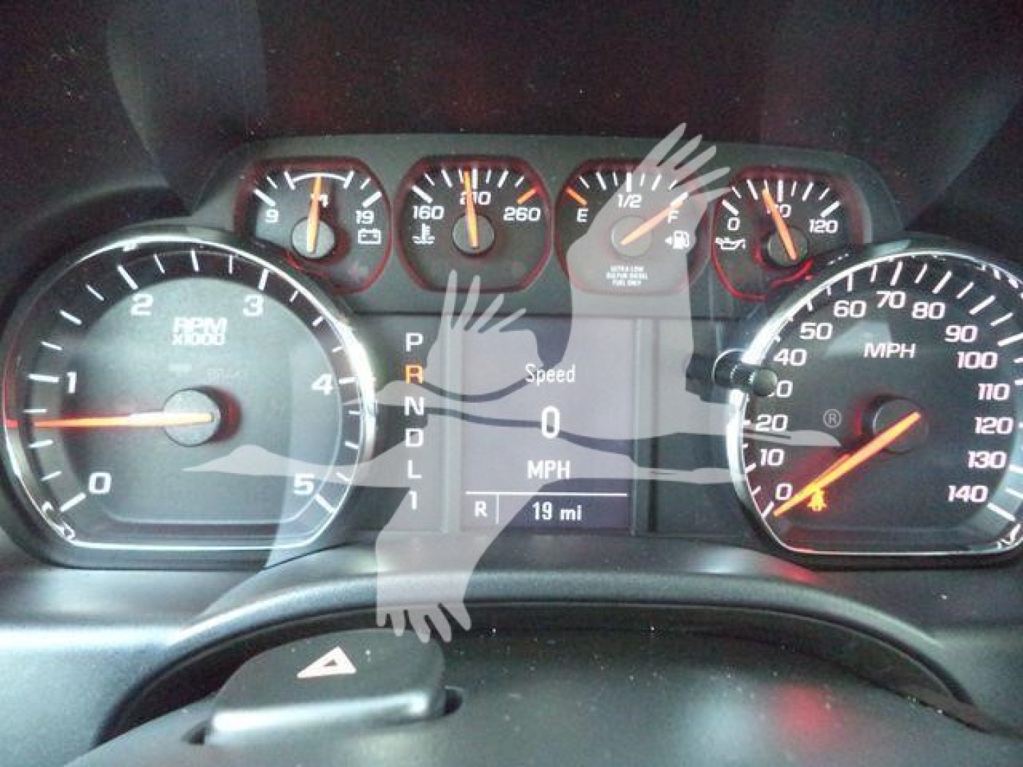 Dashboard of a Chevrolet Silverado 6500HD showing instrument cluster including tachometer, speedometer, and digital display with PRNDL indicator and 19 mi fuel readout.