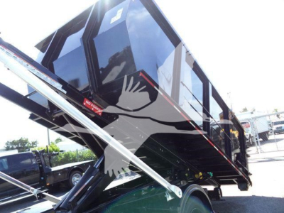 Truck bed/dump body trailer on a Silverado chassis showing hydraulic lift supports and steel frame.