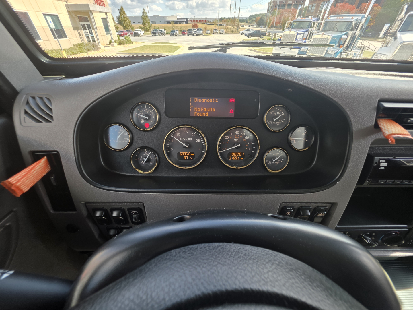 Peterbilt 337 dashboard view showing instrument cluster with digital diagnostic display reading 'Diagnostics No Faults Found' and multiple gauges.