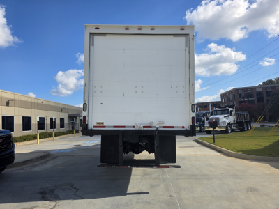 Rear view of a 2020 Peterbilt 337 box truck showing the back doors and rear bumper.