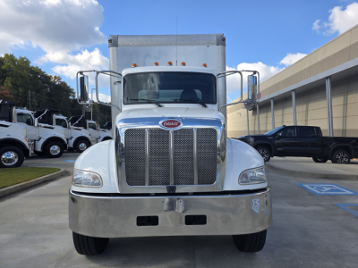Peterbilt 337 box truck front view showing chrome grille and bumper with headlamps.