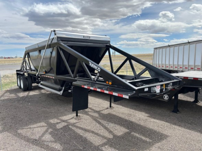 Ranco Versa Vale dump trailer in serviceable condition showing triangular truss frame, dual-axle tandem wheels, and front hitch with RAC hood.