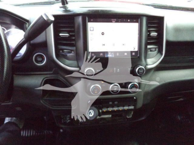 Ram 5500 dashboard and center touchscreen showing infotainment display and control knobs.