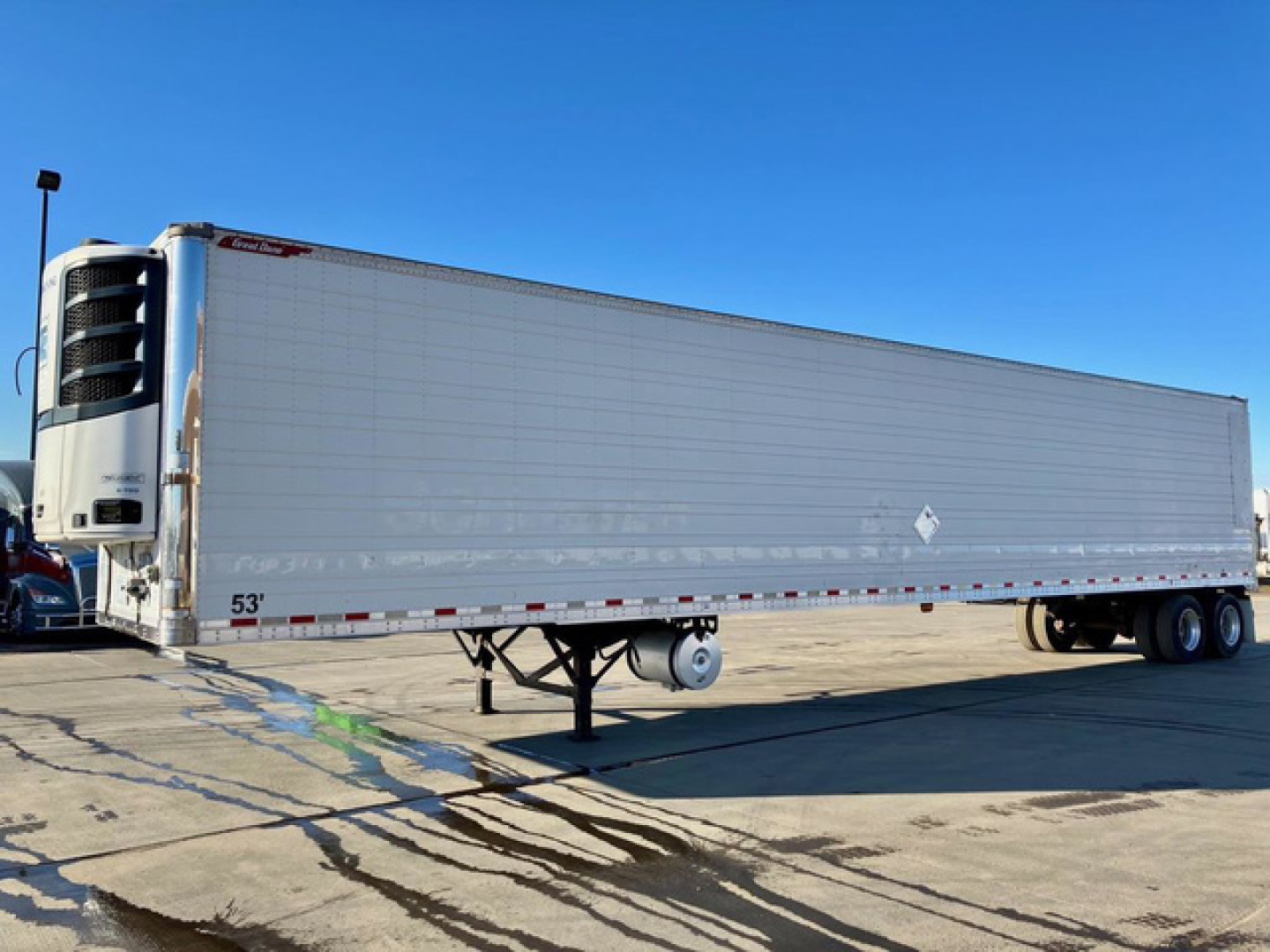 Great Dane reefer trailer in side view with refrigeration unit, 53' length, silver exterior, raised landing gear, two axles at rear, stock number KTS1868, VIN 1GRAA0626JW101218.