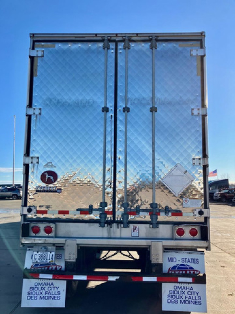 Great Dane reefer trailer back view showing diamond plate doors and rear lights.