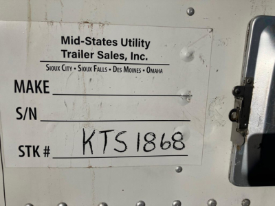 Reefer trailer rear door with Mid-States Utility Trailer Sales, Inc. label showing stock number KTS1868 and handwritten STK # KTS1868 on white plate.