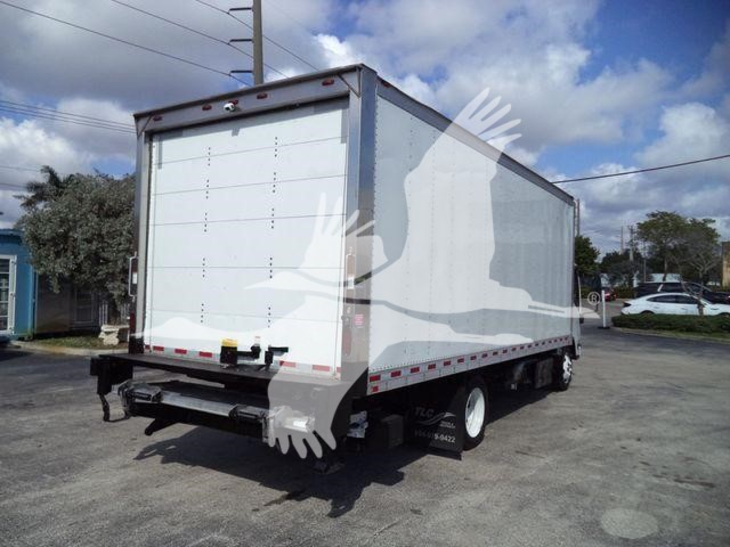Isuzu NPR box truck rear view showing cargo box and wheels