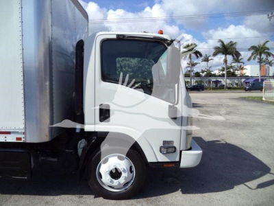 Isuzu NPR box truck cab and front wheel shown in side view with white paint and stock number 210707FM not visible but implied