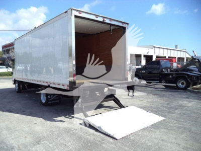 Isuzu NPR-style box truck with ramp lowered at rear showing cargo area; alloy wheels; stock number 210707FM; rear entry