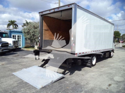 Isuzu NRR box truck with rear ramp open, cargo area visible, stock number 210707FM, side view showing box, wheels, and loading ramp.