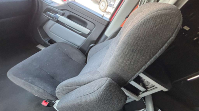 Kenworth T680 interior seat view showing front passenger seat and door panel.