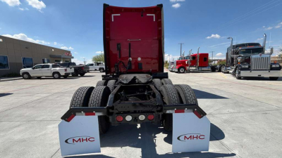 Vehicle image showing rear view of a 2022 Kenworth T680 tractor with dual rear axles, mudflaps branded MHC, and fifth wheel; stock 0630689; VIN partially visible