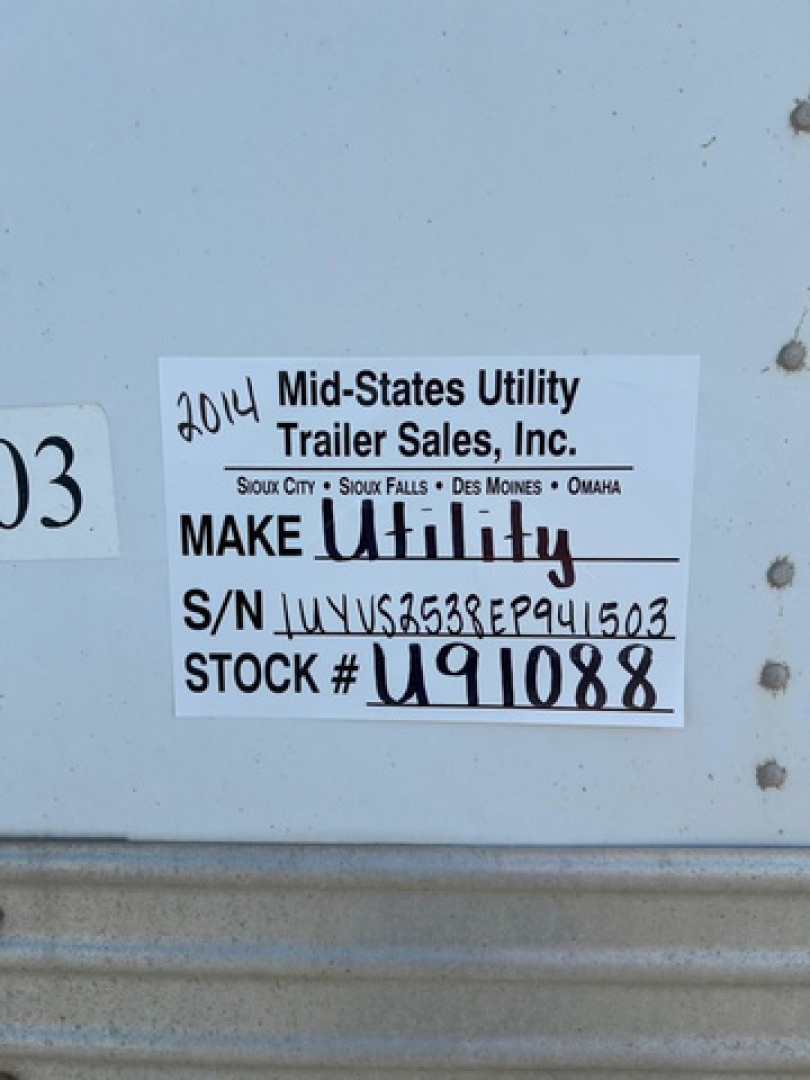 Sticker label on utility trailer showing 2014 Mid-States Utility Trailer Sales, Inc. MAKE Utility, S/N J... STOCK # U91088