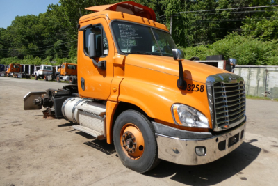 Freightliner Cascadia 125 conventional daycab truck shown in orange side view with cab number 3258 and stock tag 1112244.
