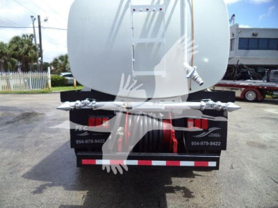 Rear view of 2015 Ford F650 SD truck showing tanker and rear bumper with stock contact numbers.
