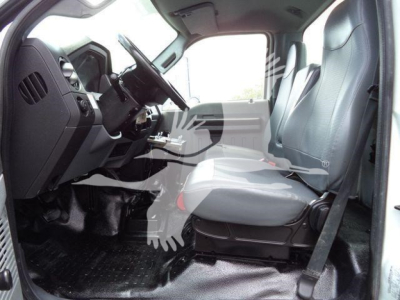 Ford F650 interior cab view showing front seats and dashboard with steering wheel and driver seat belt.