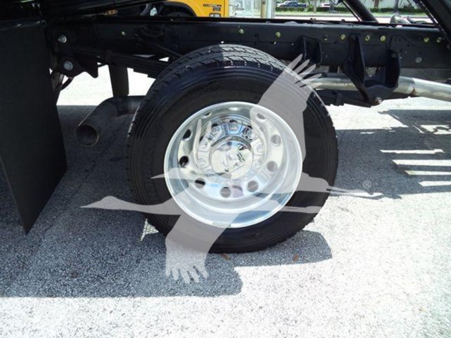 Ram 5500 rollback truck wheel and suspension showing front wheel with hub and tire.